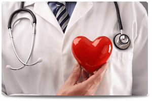 doctor holding toy red heart to chest