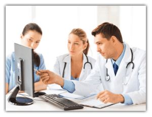 doctors looking at a computer screen