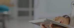 close up of hands on a tablet