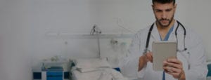 doctor reviewing medical images on tablet