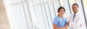 medical staff with medical records smiling
